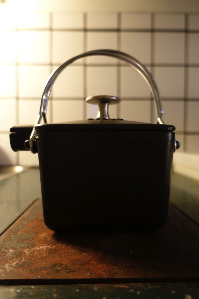 A cast iron teapot on the stove