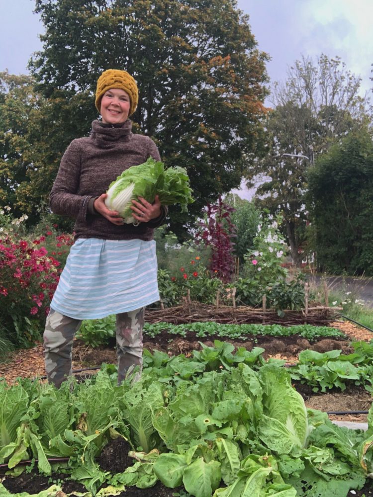 Sara with a napa cabbage in her arms. 